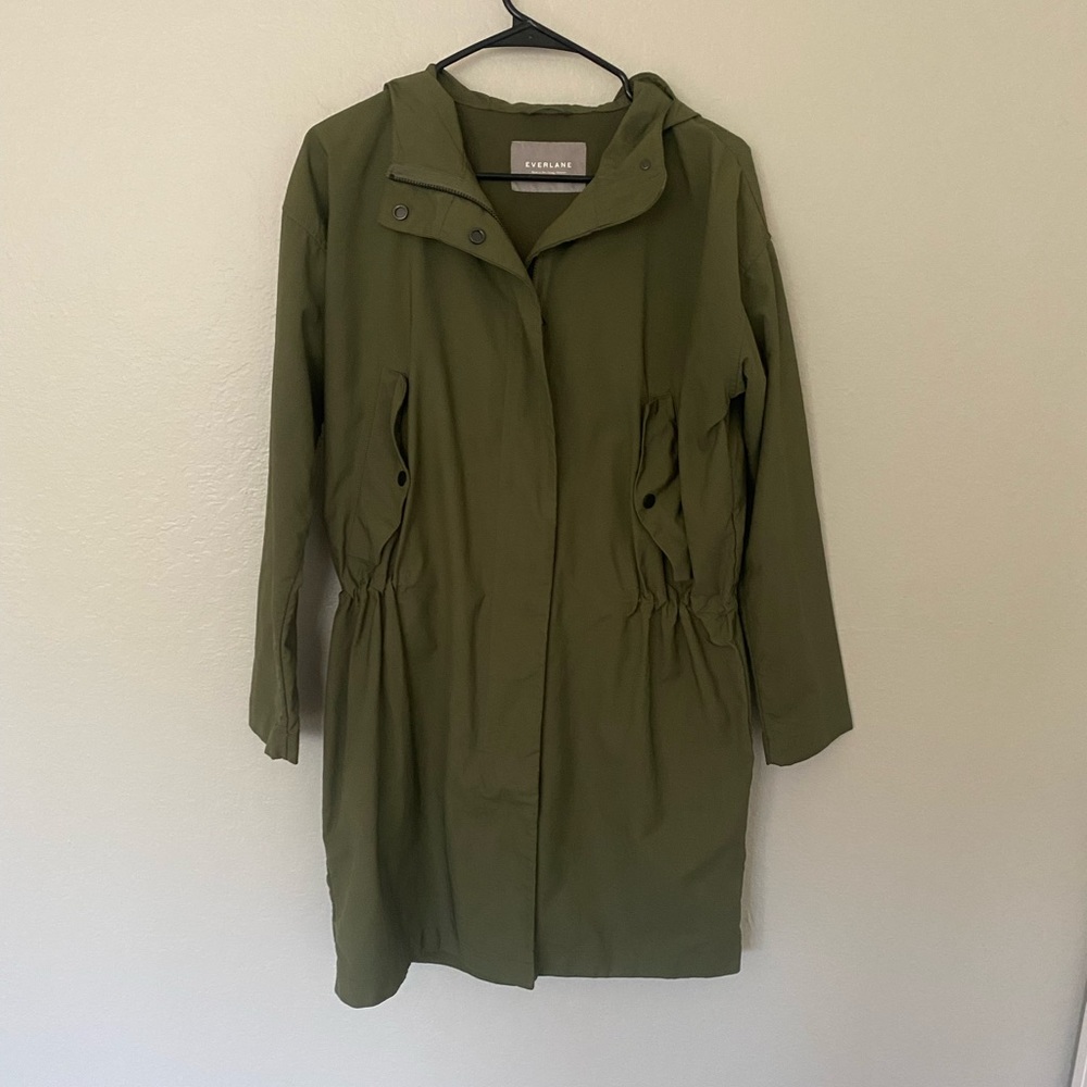 Green Everlane rain jacket
